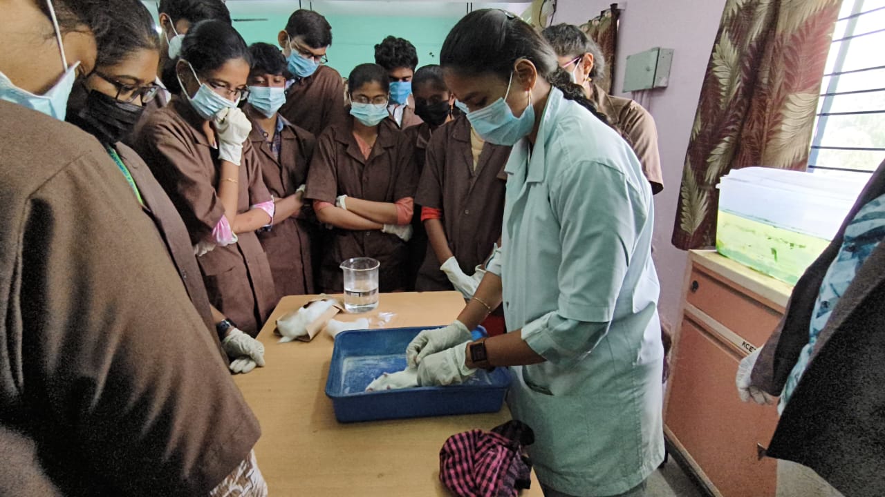 Research trainees operating laboratory equipment during practical training