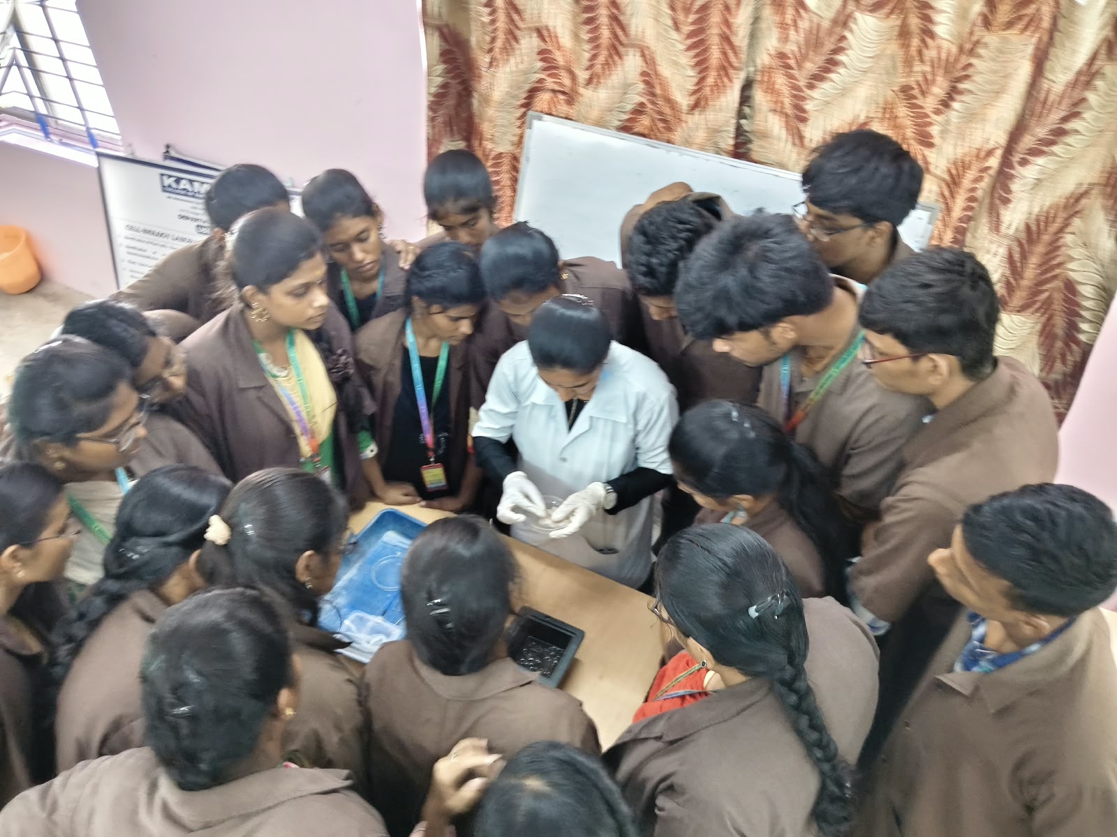 Research trainees operating laboratory equipment during practical training